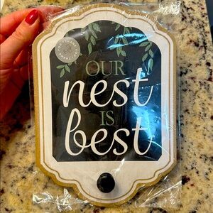 "Our Nest Is Best" hanging sign